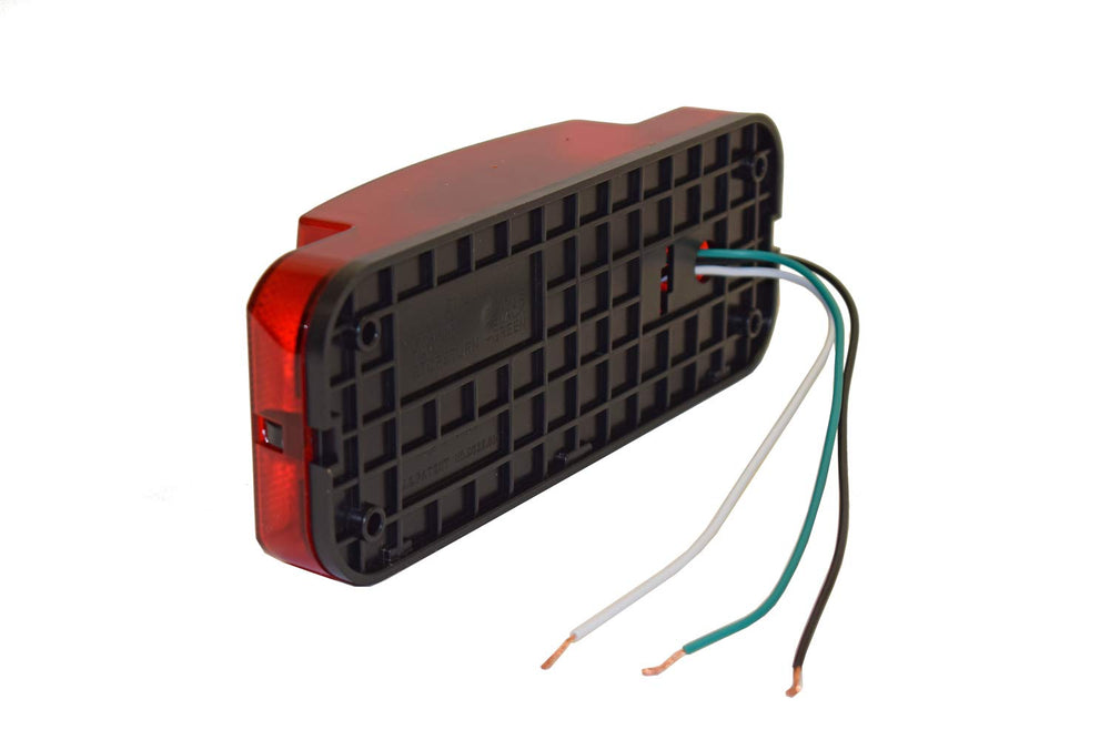 Optronics tail light beside ruler showing dimensions for accurate size and mounting planning