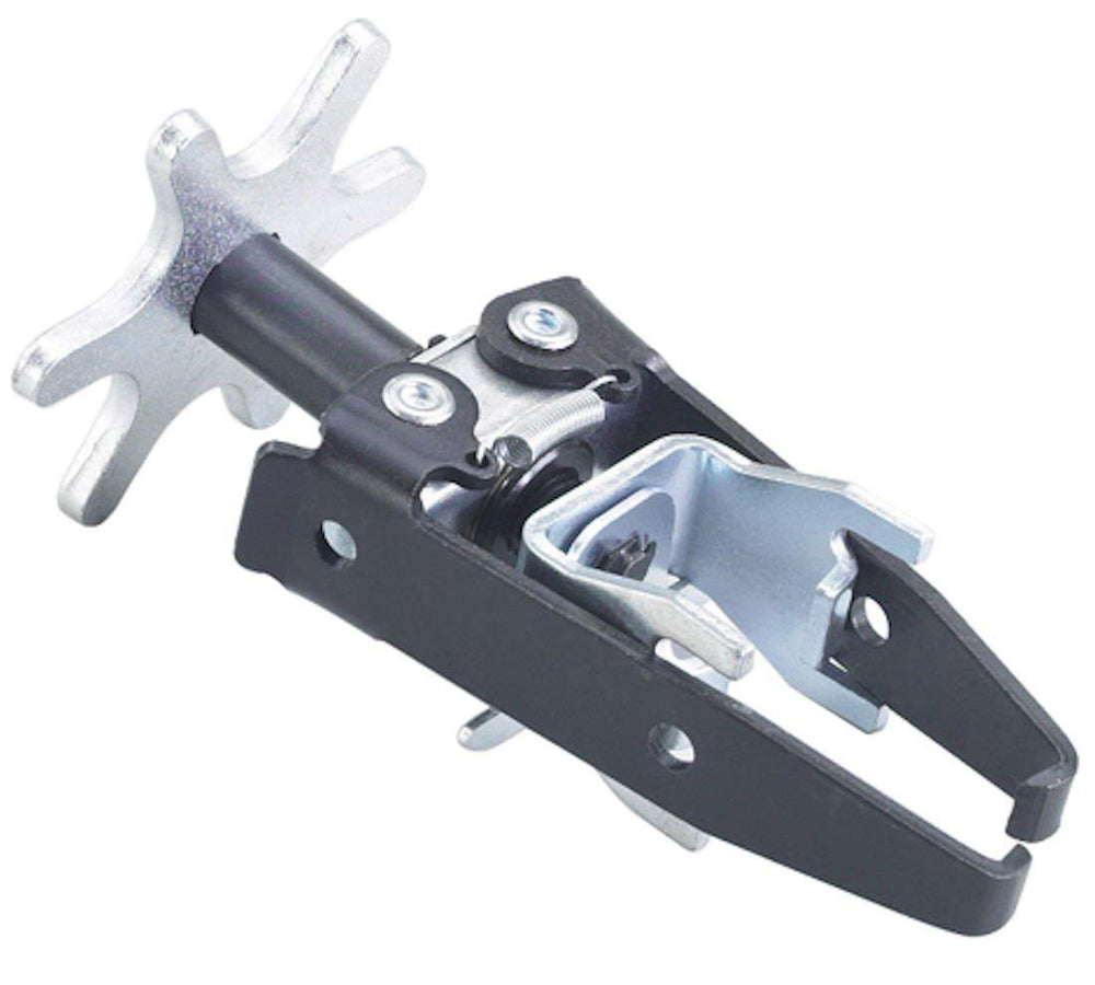 OTC 4573 front-angle showing tool and adapters, offering stable valve spring compression