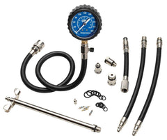 OTC 5605 gauge close-up showing dual-scale readout and protective boot for clear readings