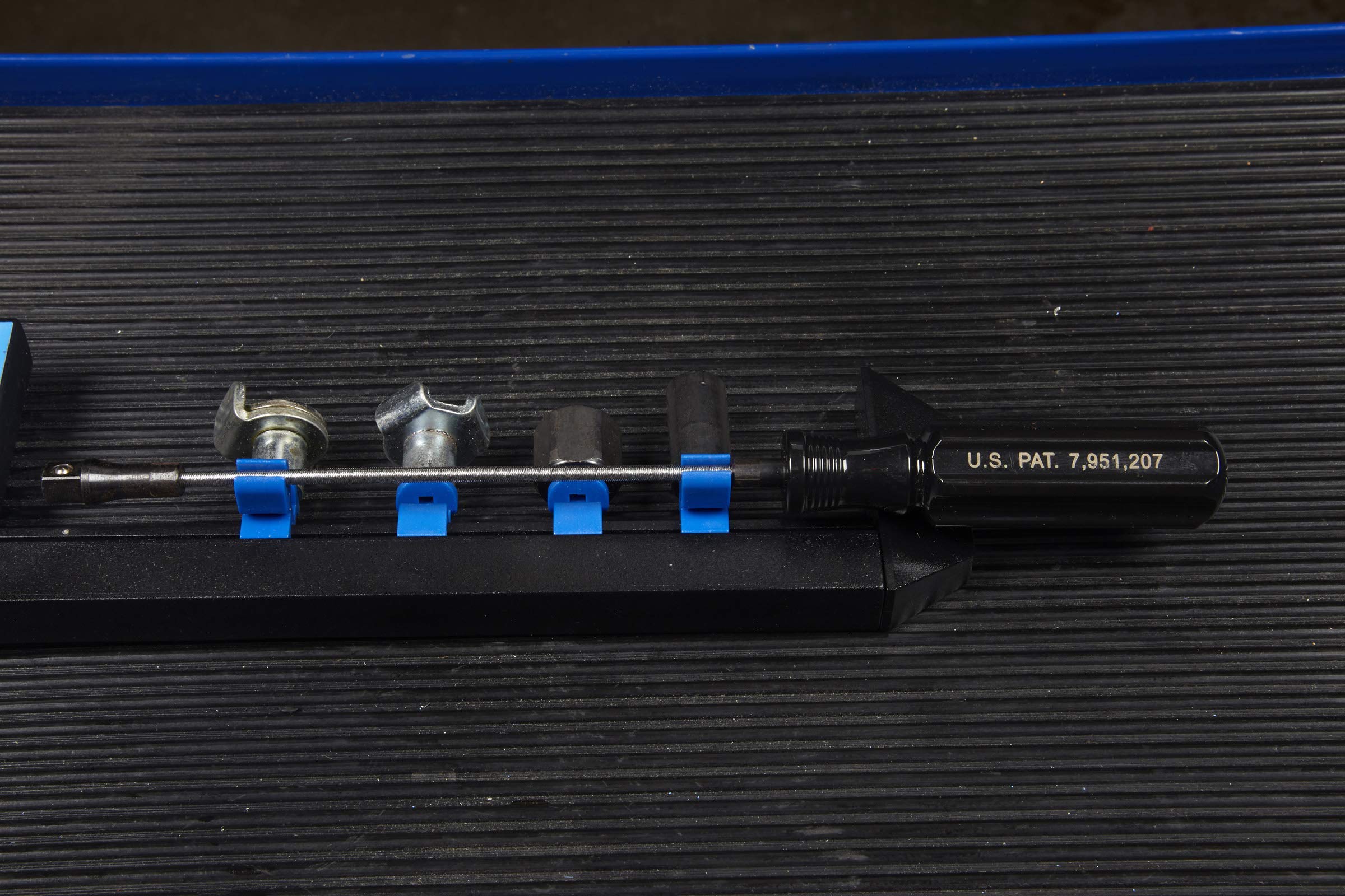 OTC 5961 kit in use under vehicle reducing splash and protecting hands