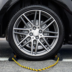 OULEME chock in use under a trailer wheel preventing movement on slope
