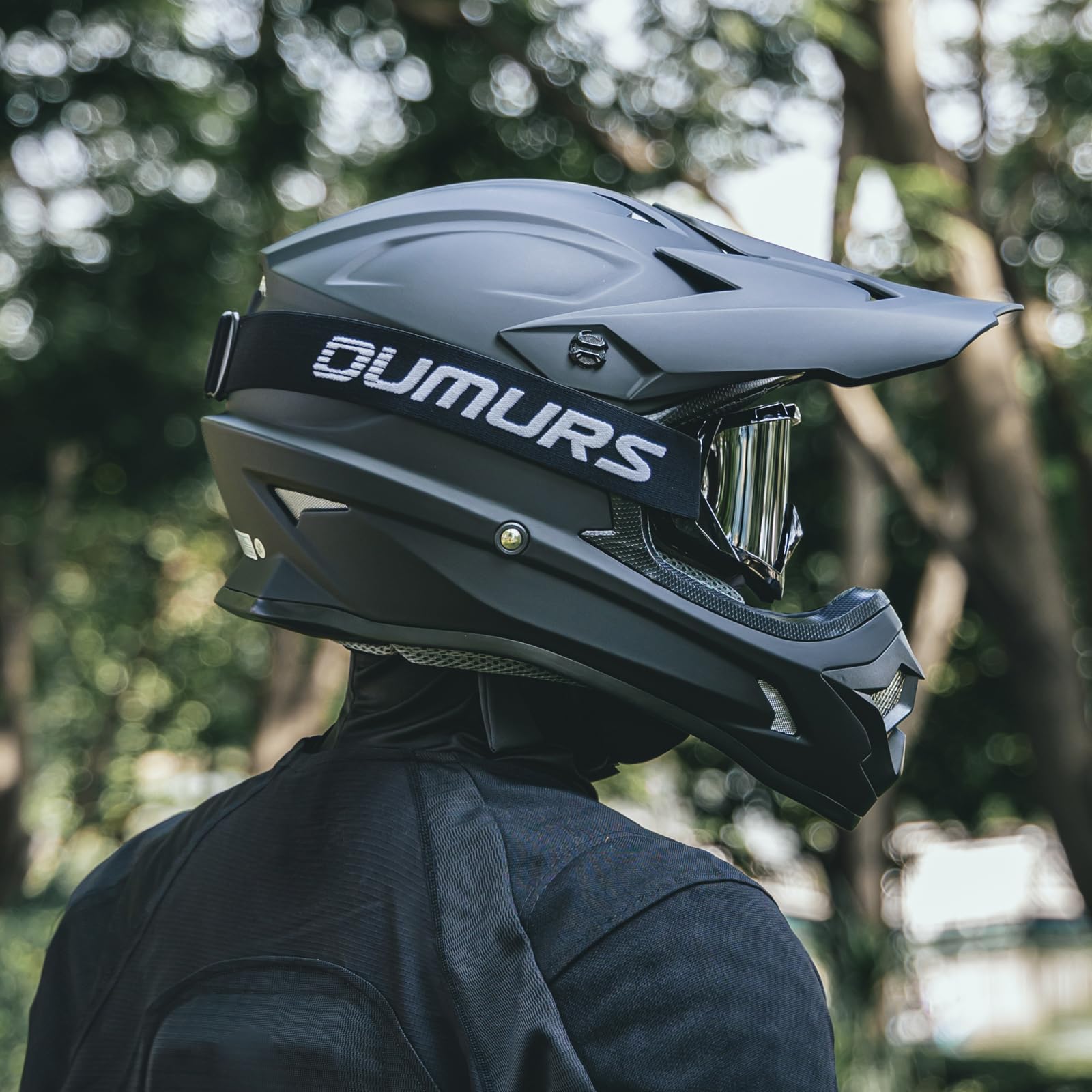 Oumurs helmet on ATV lifestyle image showing real-world riding use