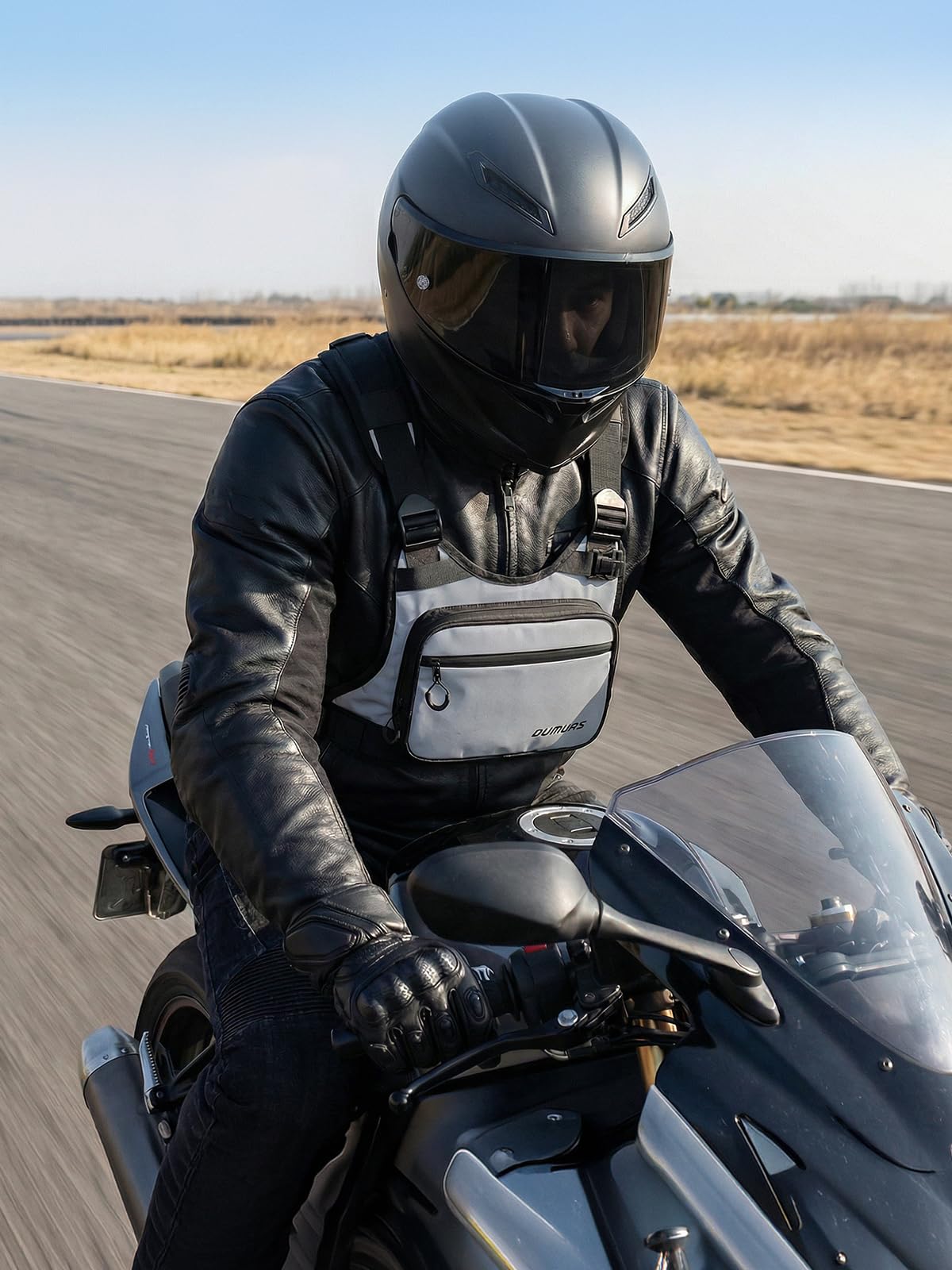 Oumurs chest bag in night commute scene improving rider visibility