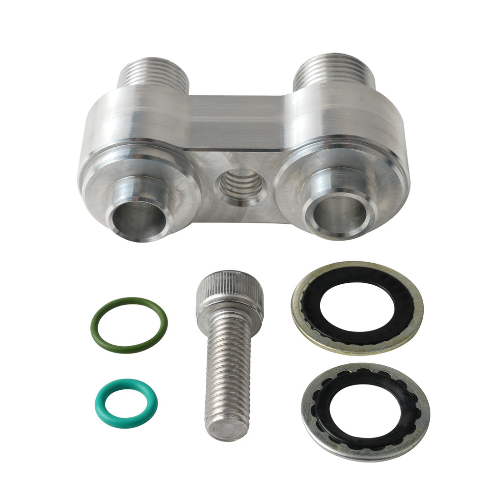 Outopakkle adapter next to ruler showing compact scale for easy engine-bay routing