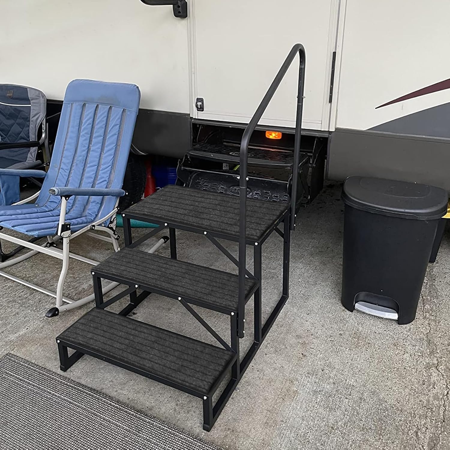 OUTPRIZE stair beside RV door showing scale and easy access