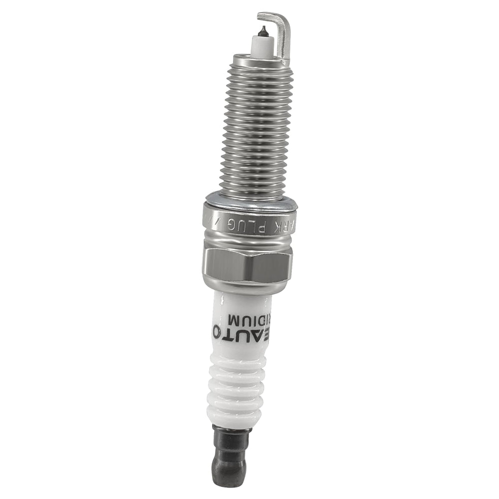Four OYEAUTO spark plugs beside a ruler showing scale and complete replacement set