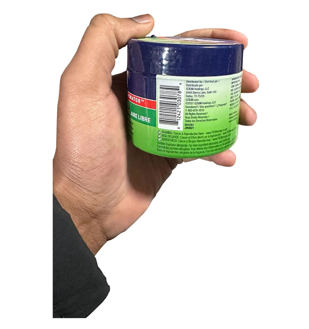 Ozium held in hand showing compact size and easy portability benefit