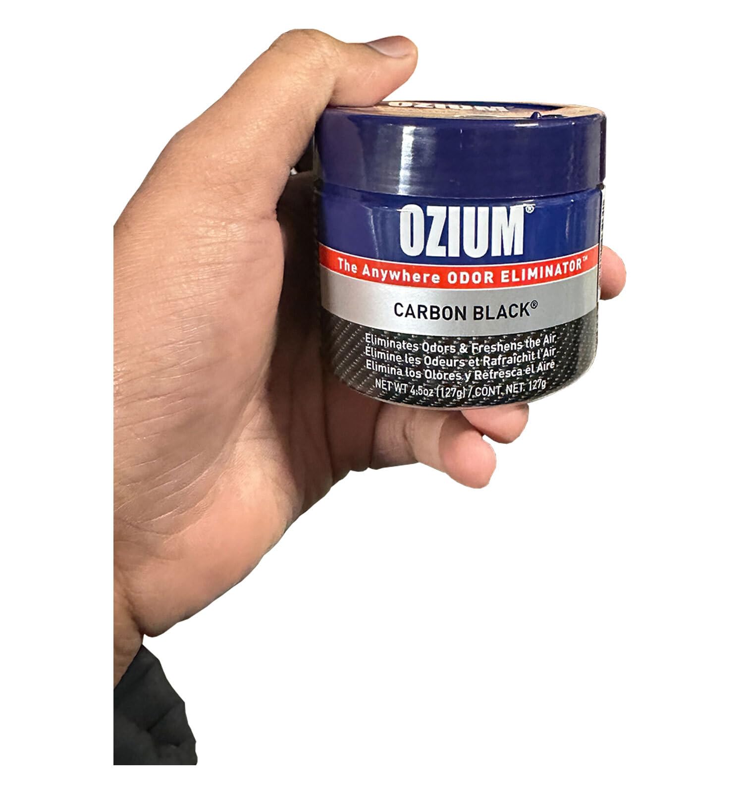 Ozium placed in car cupholder showing continuous in-vehicle odor removal