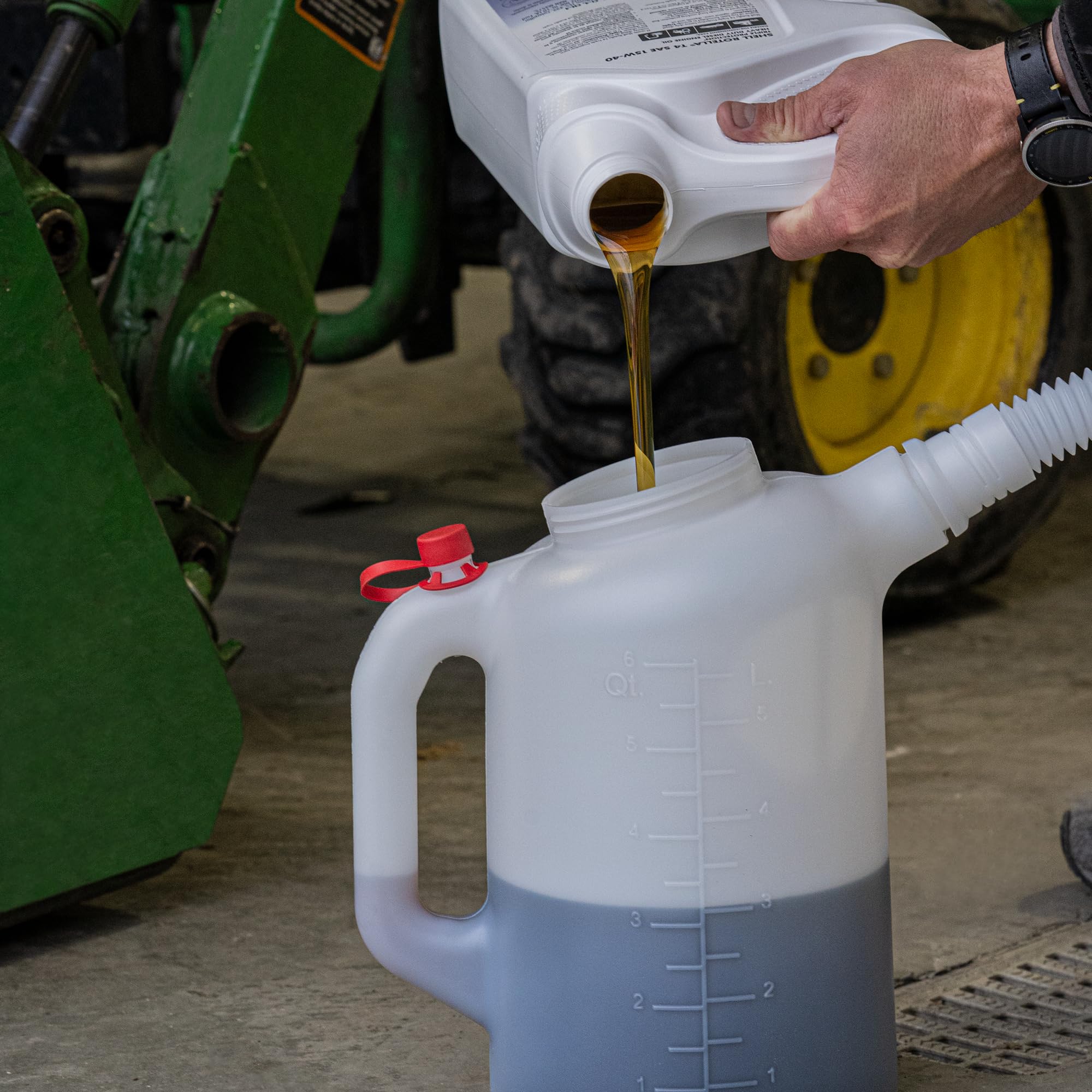 PAK jug pouring into engine funnel illustrating controlled, accurate fluid transfer
