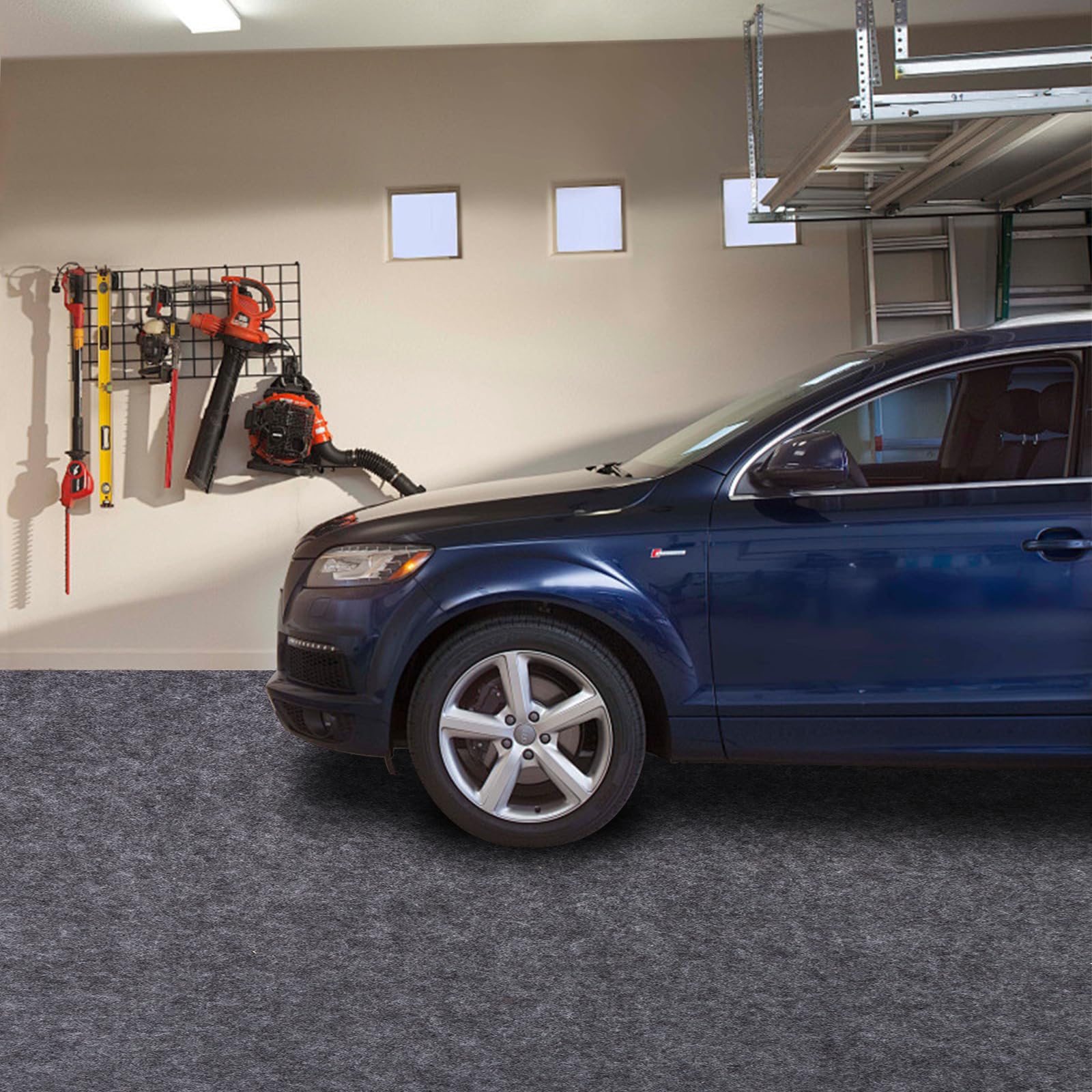 PANDOROOM mat beside a car to show scale and full parking coverage