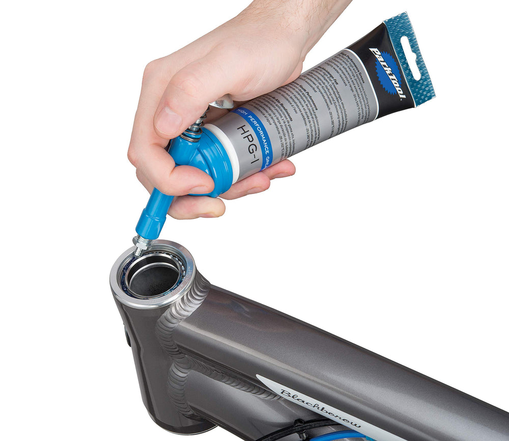 Park Tool GG-1 close-up of small tip in use offering precise grease placement and less mess