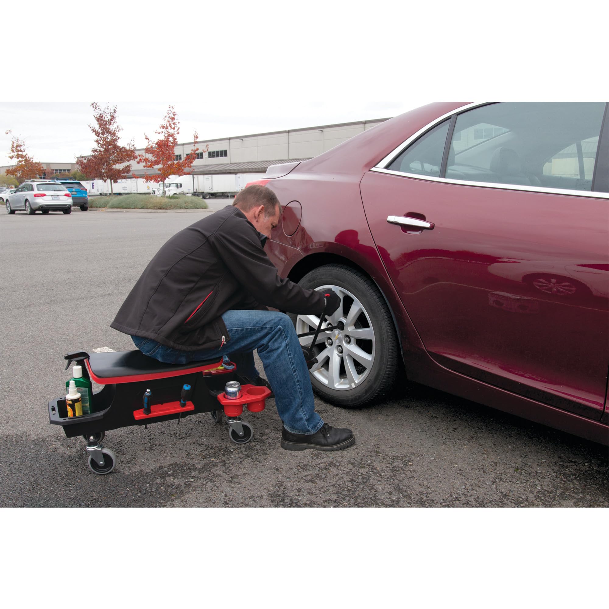Performance Tool W12 being used on a car wheel showing leverage and easier lug removal benefit