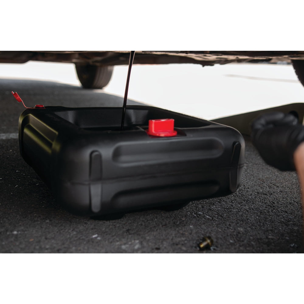 Performance Tool positioned under vehicle drain port for cleaner, safer oil changes
