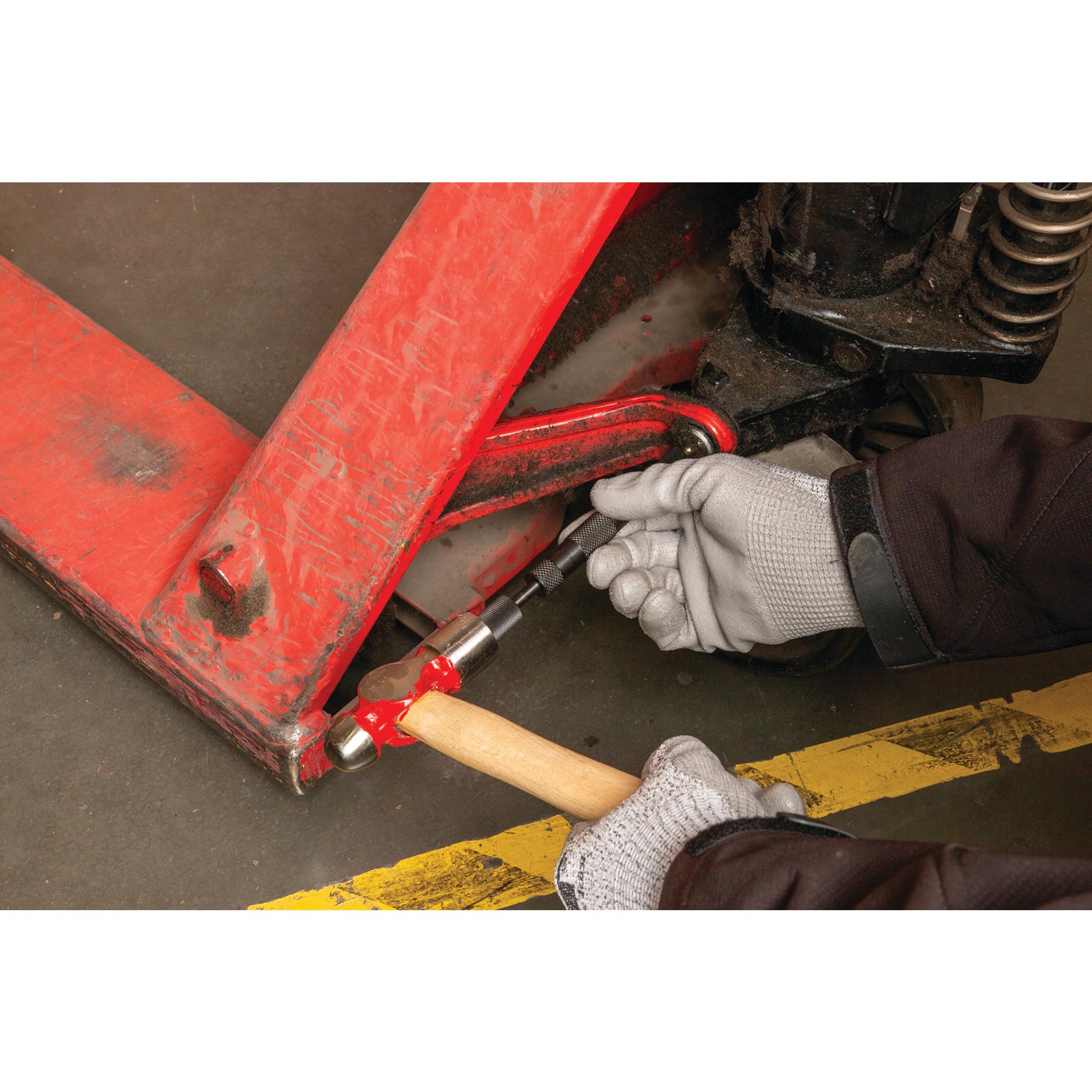 Performance Tool W54209 seated on an angled grease fitting, services tight locations benefit