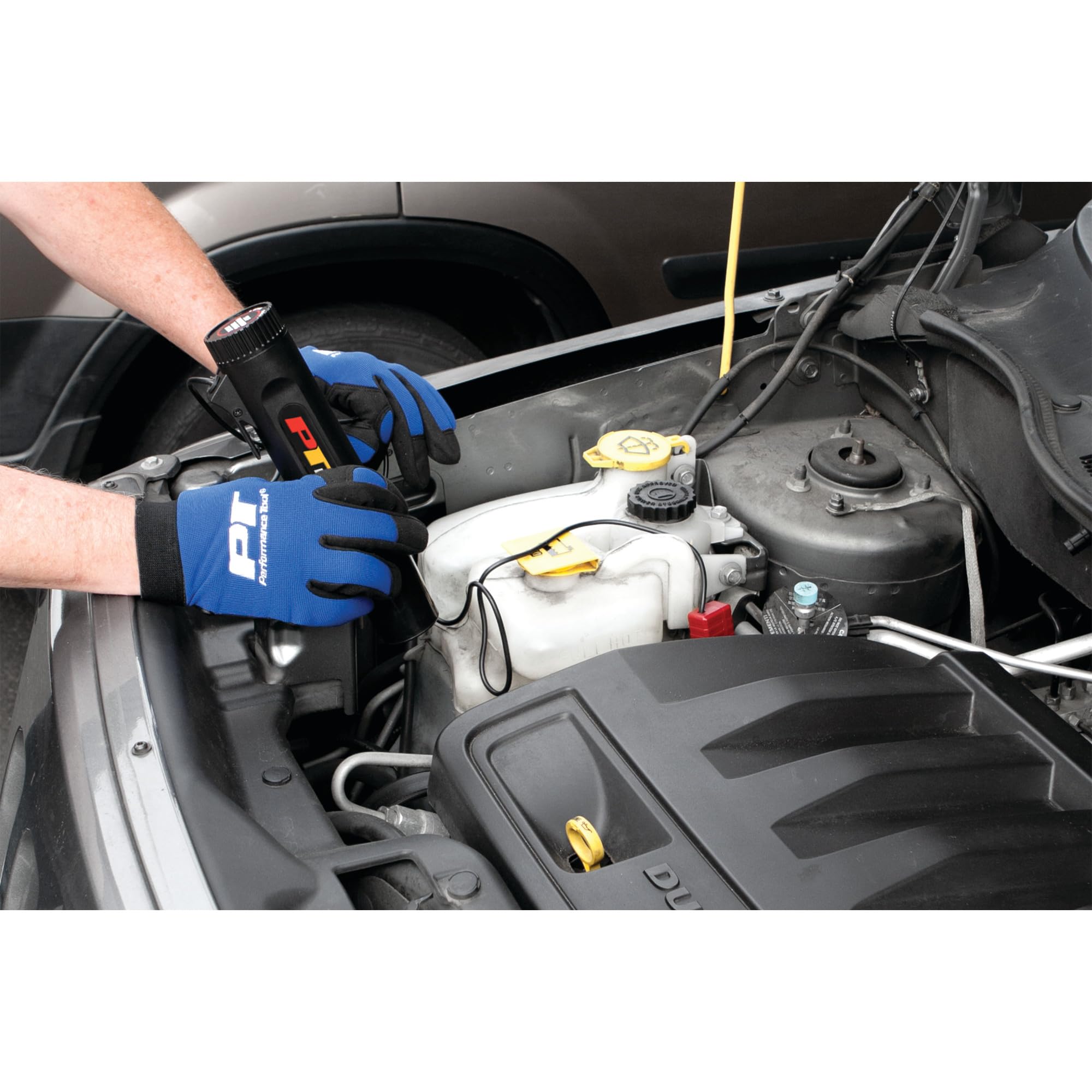 Performance Tool work light in use illuminating engine bay for improved visibility