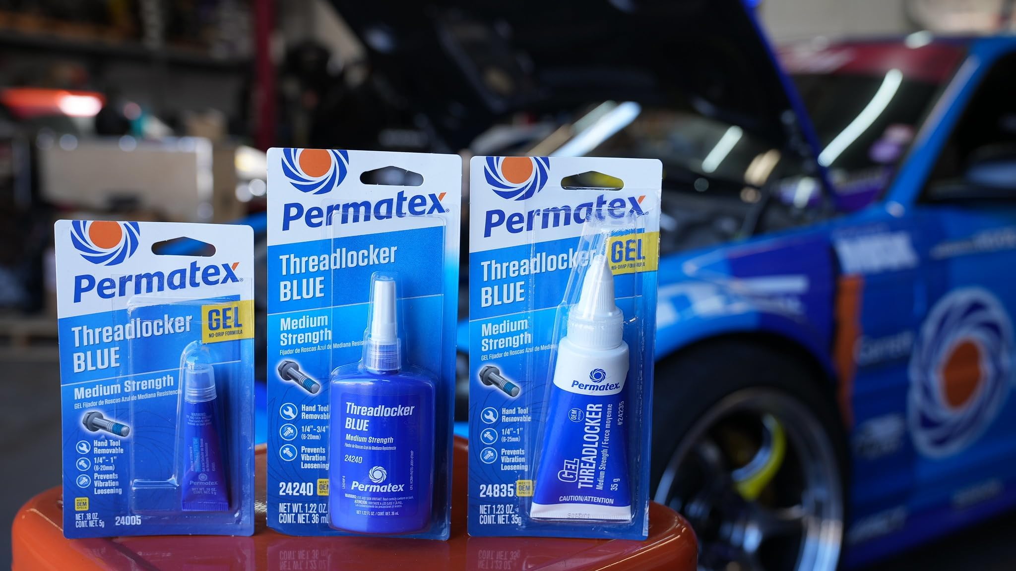 Permatex being used on an engine valve cover bolt, brand prevents loosening