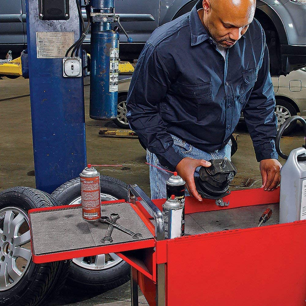 PIG mat rolled out on shop floor absorbing oil for safer, cleaner workspace