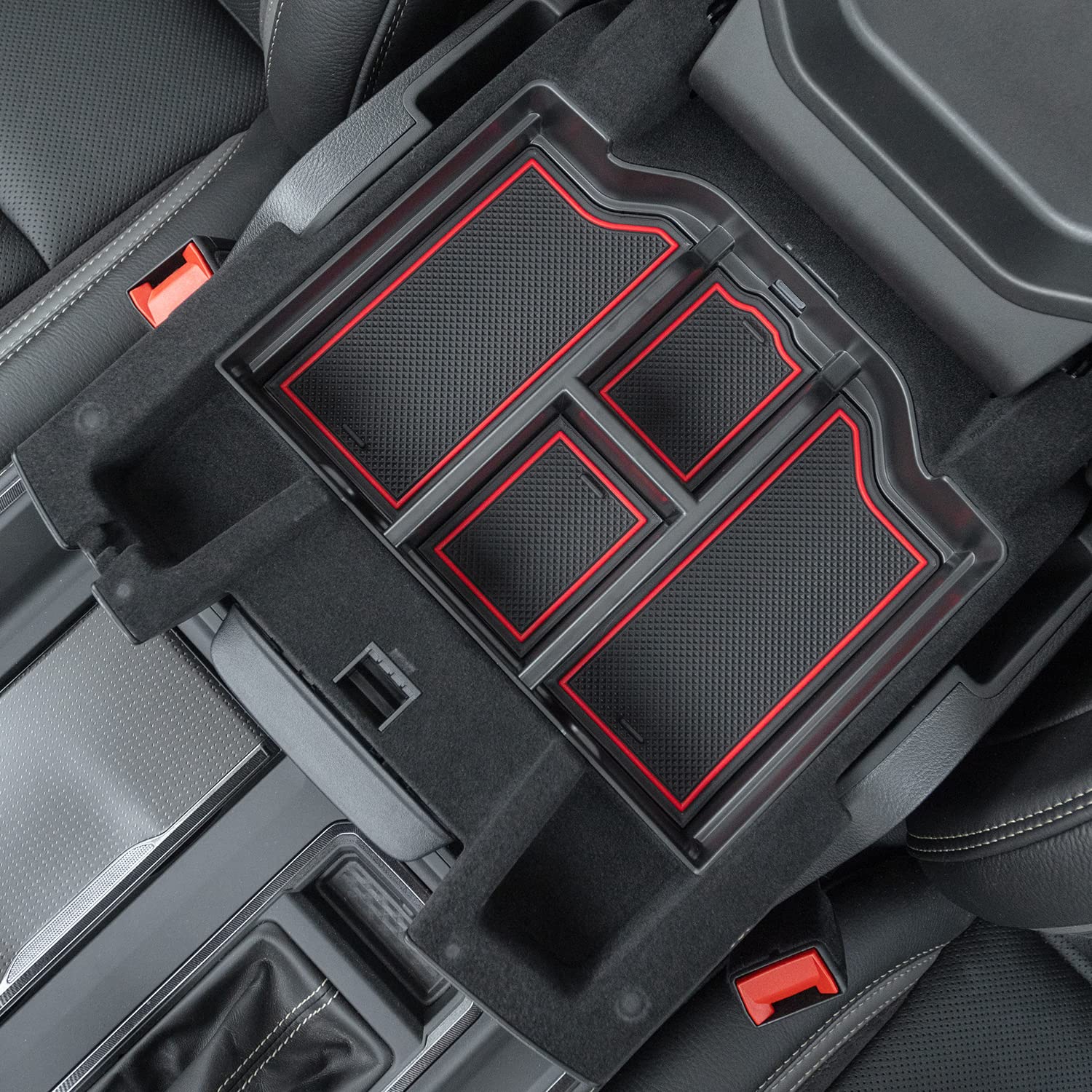 PIMCAR lifestyle shot of driver reaching into organized console for quick access