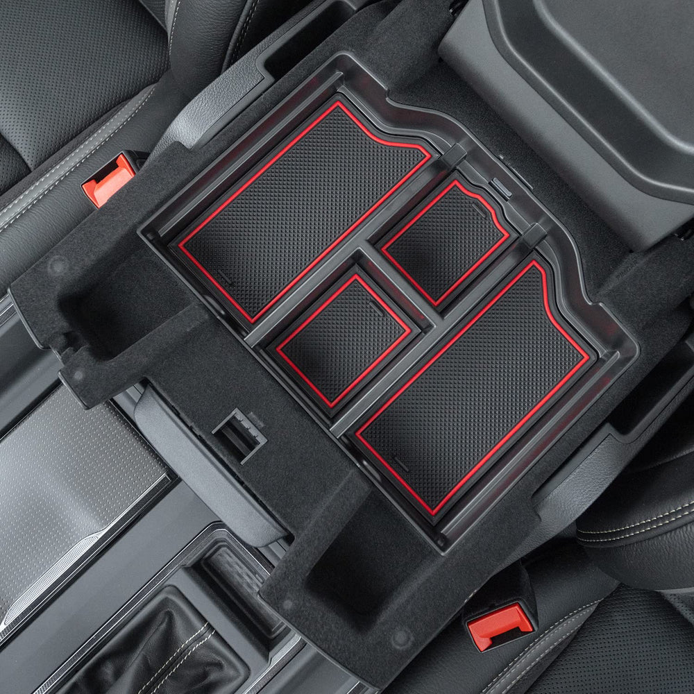 PIMCAR lifestyle shot of driver reaching into organized console for quick access