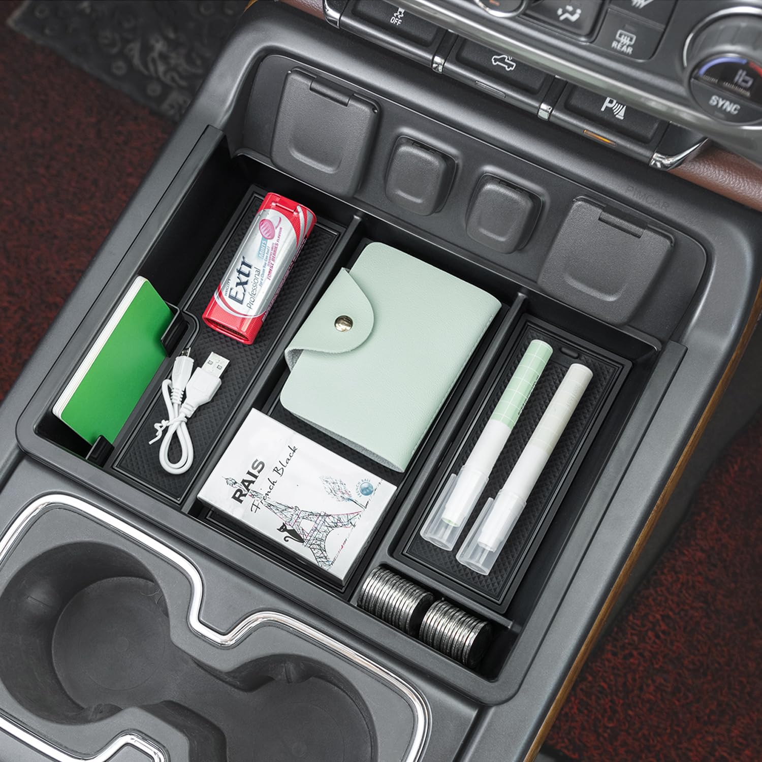 PIMCAR next to a smartphone to demonstrate phone capacity and size fit