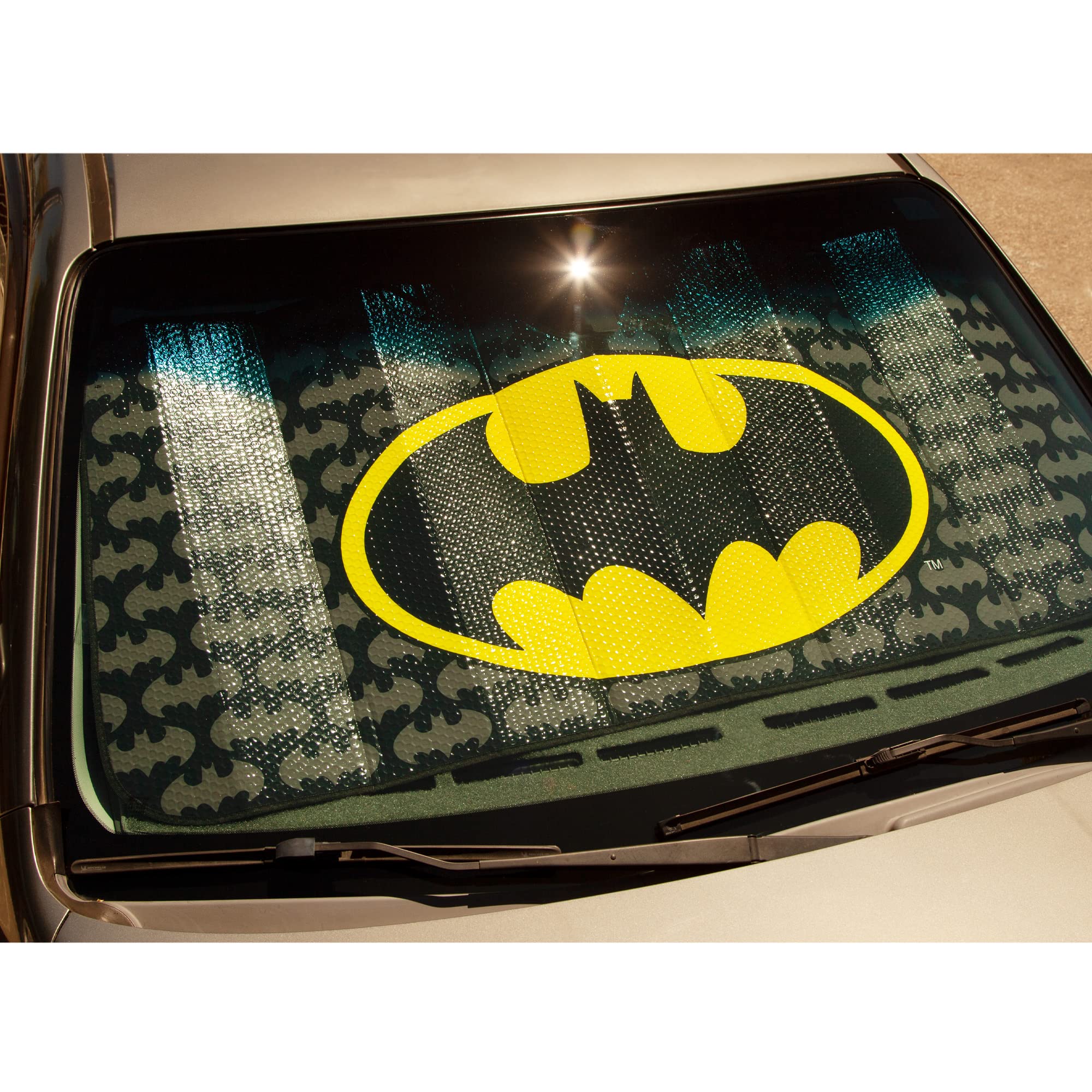 Plasticolor sunshade next to ruler showing 58 by 27 inches for fit verification