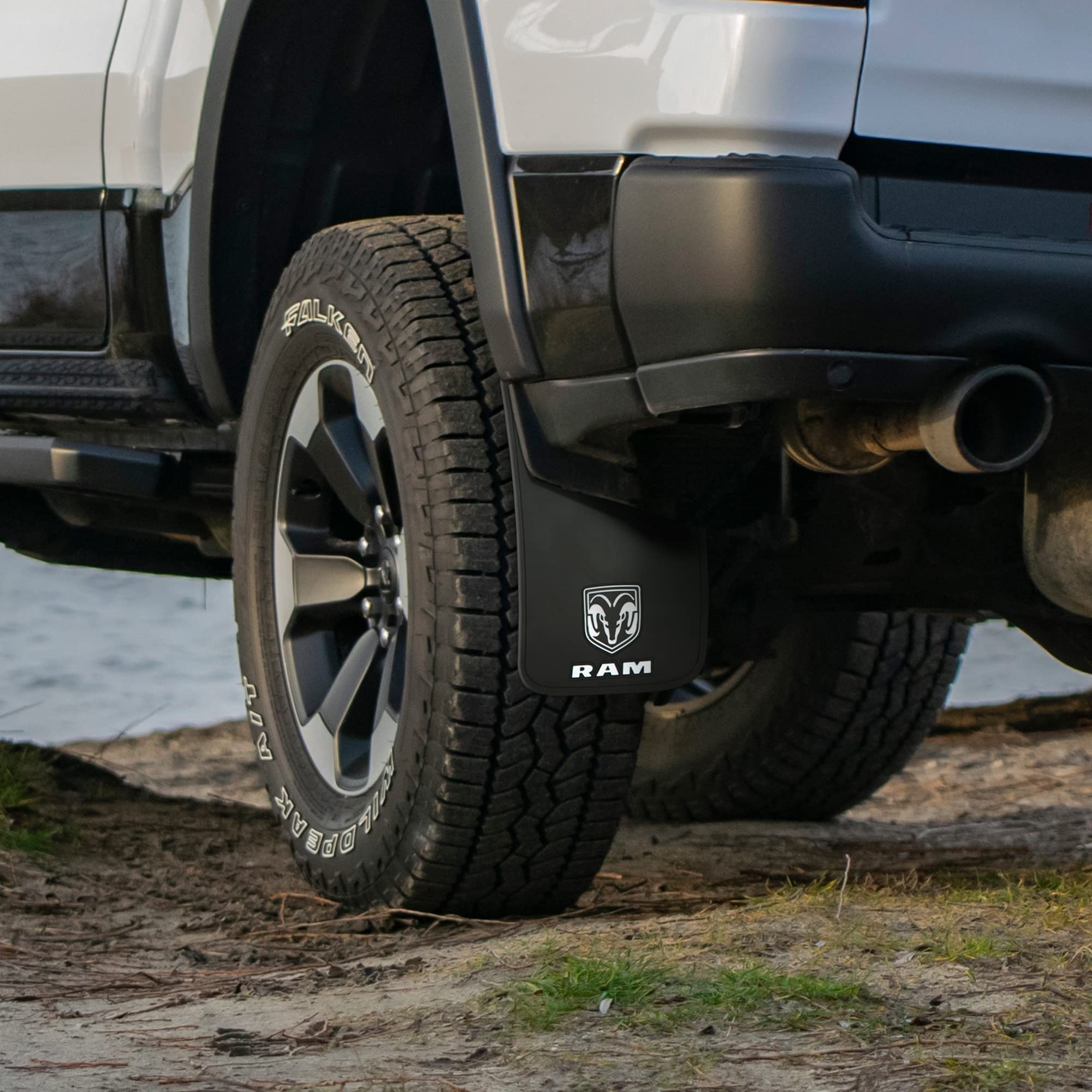 Plasticolor RAM on truck driving gravel road showing debris protection benefit