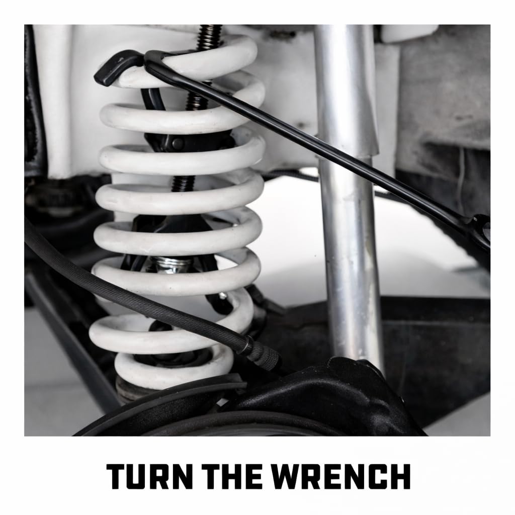 Powerbuilt next to coil spring for scale, shows compatibility and capacity