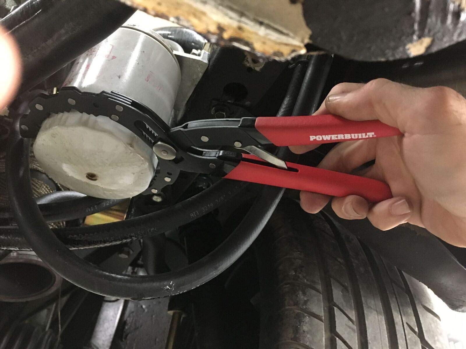 Powerbuilt pliers removing oil filter in garage setting for faster oil changes