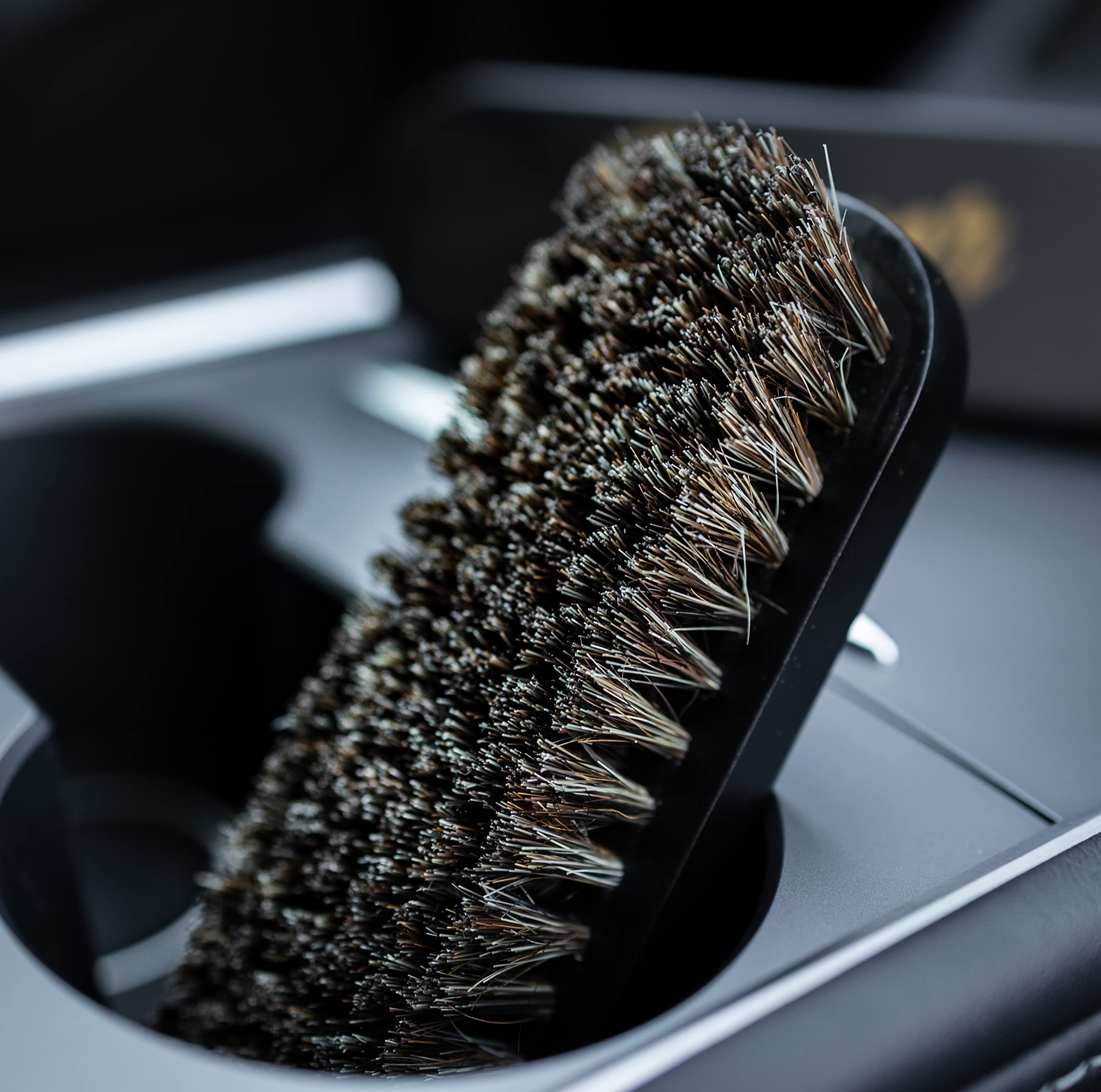 PROPER DETAILING CO. brushes staged with cleaner bottle for product use