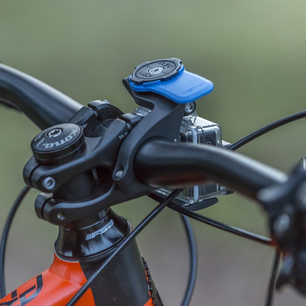 Quad Lock clamp detail close-up showing secure bolt and sturdy mounting benefit