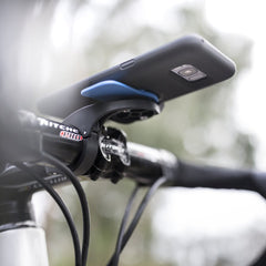 Quad Lock with phone locked in place illustrating reliable dual-stage security on rides