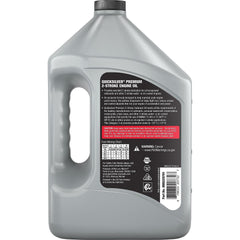 Quicksilver bottle next to outboard engine demonstrating marine compatibility