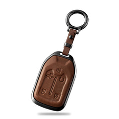 Qunzes front view showing brown leather cover and polished metal, adds refined protection