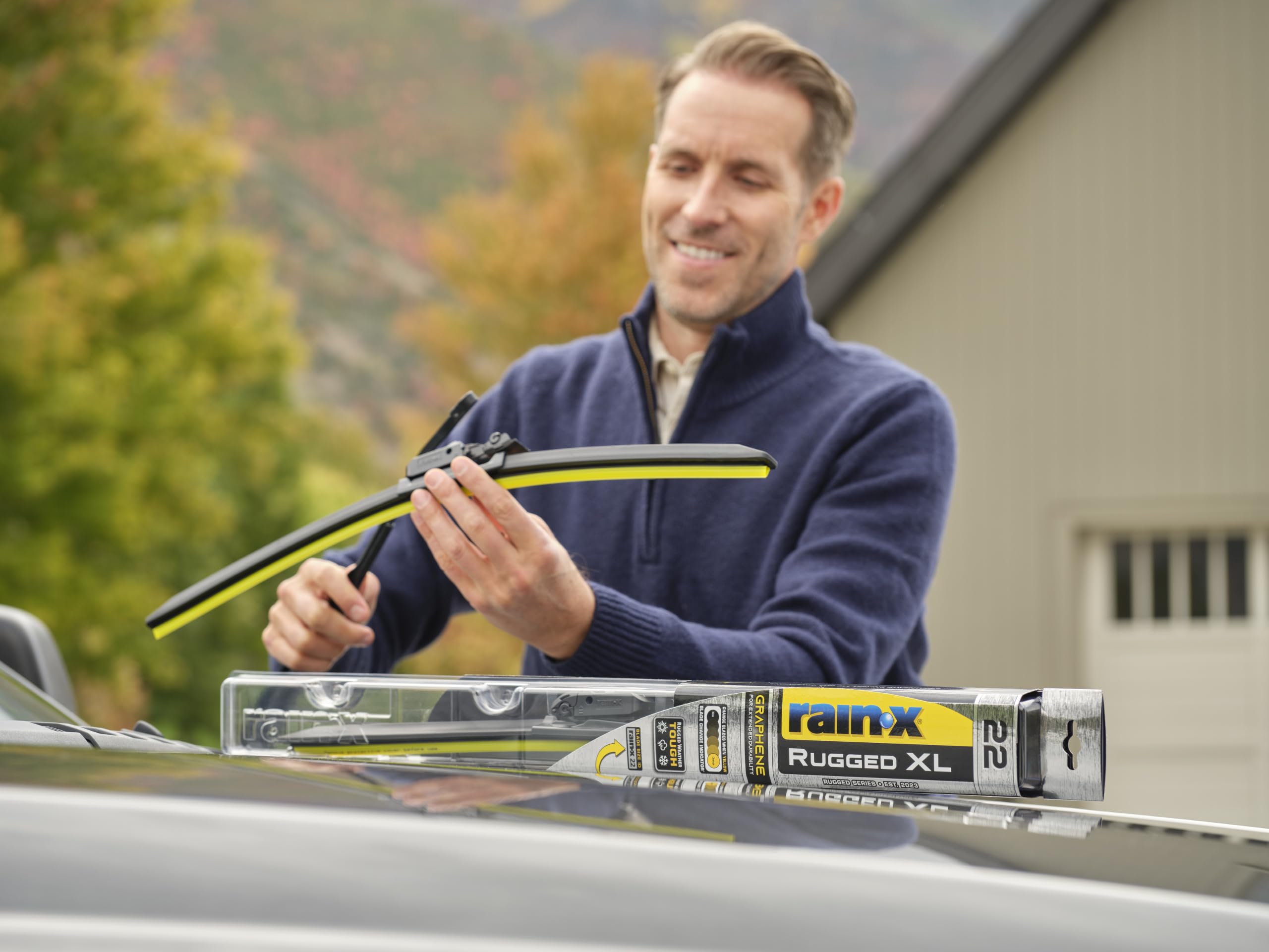 Rain‑X blade wiping a wet windshield demonstrating clear visibility benefit