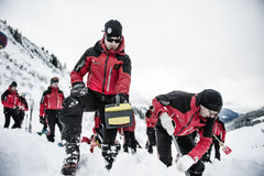 RECCO reflector on backpack in snow illustrating winter search compatibility