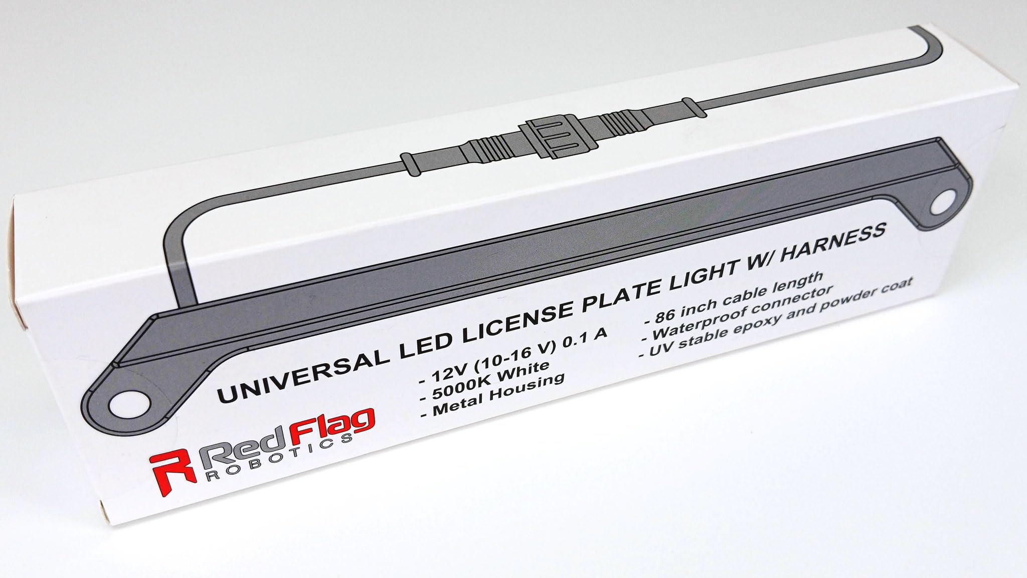 Red Flag Robotics mounted on vehicle at night demonstrating clear, even plate illumination