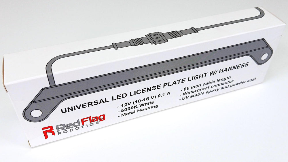 Red Flag Robotics mounted on vehicle at night demonstrating clear, even plate illumination