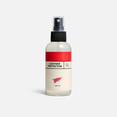 Red Wing Shoes applied on a boot in use, repelling water and protecting leather effectively