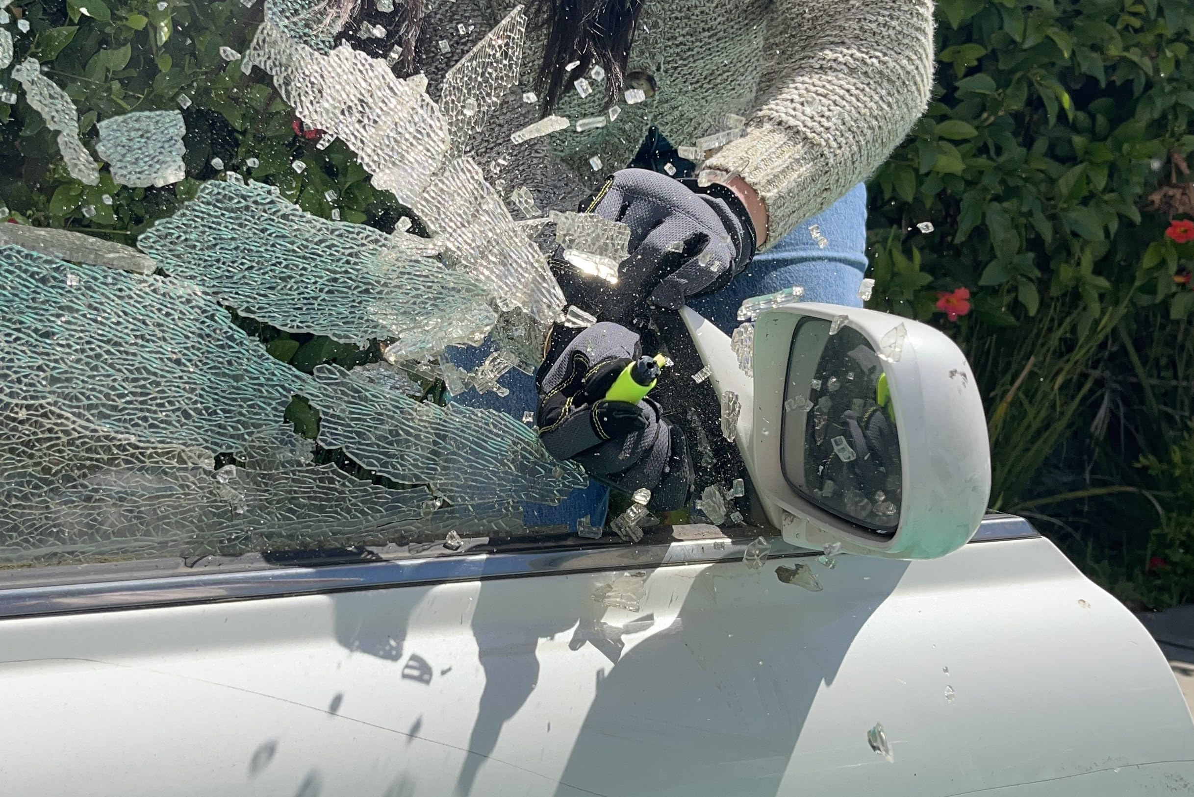 RESQME cutting a seatbelt in a demo highlighting quick release capability