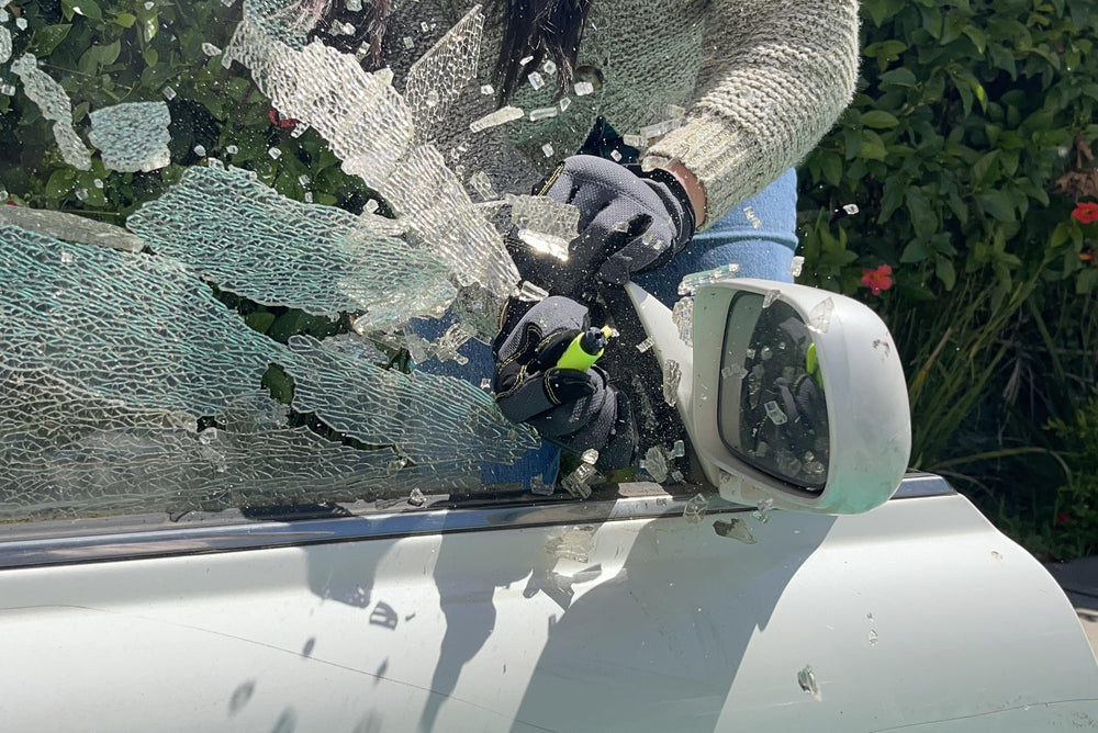 RESQME cutting a seatbelt in a demo highlighting quick release capability