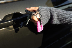 RESQME held in hand illustrating compact size for easy carry and readiness