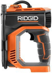 RIDGID inflator in use on a truck tire demonstrating fast inflation on the roadside