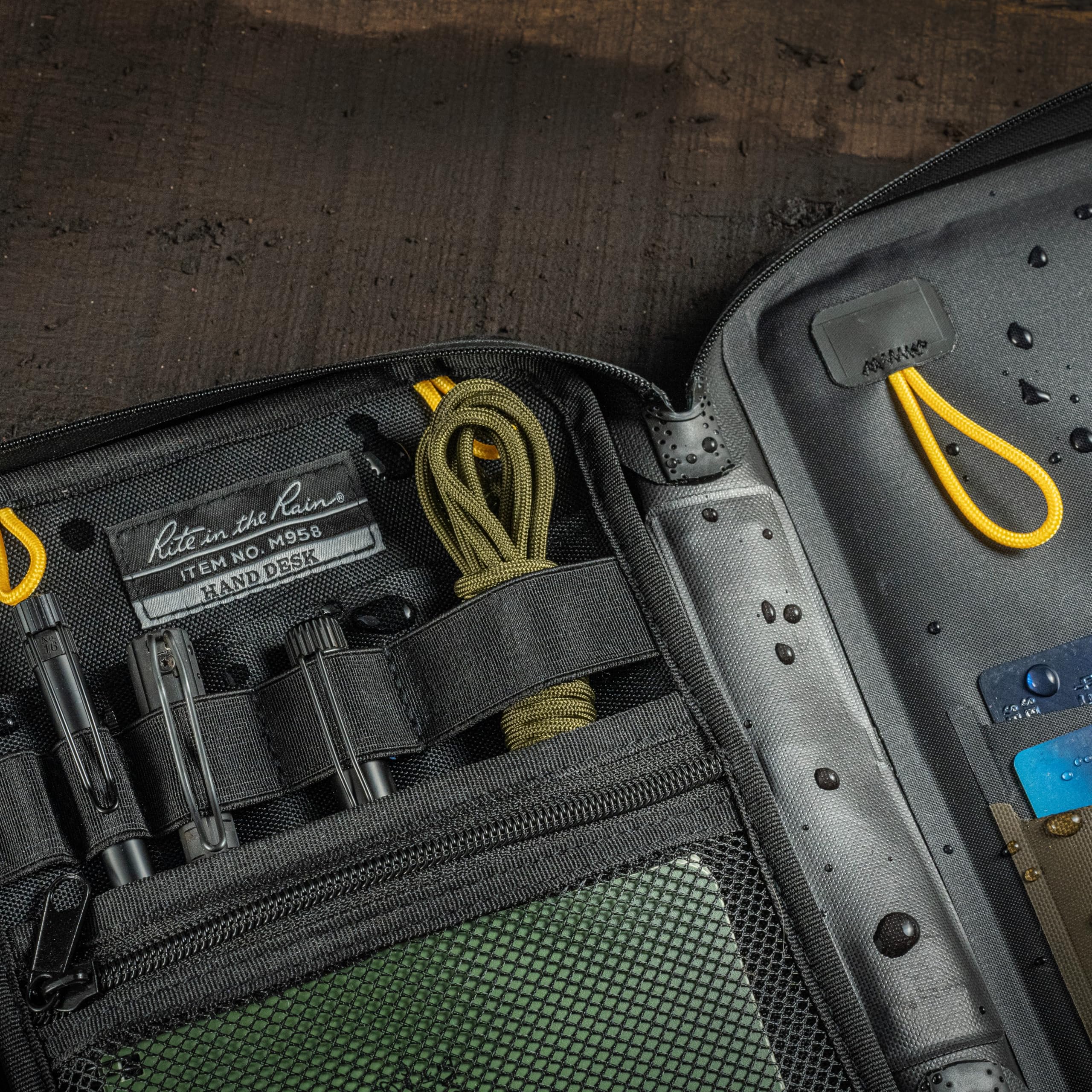 Rite in the Rain rear hang-loop storing the desk off-ground for cleaner, drier storage