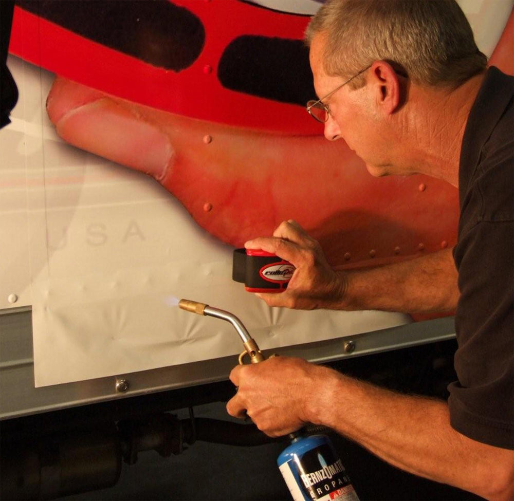 Rollepro in use on car door demonstrating faster vinyl smoothing benefit