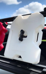 RotopaX mounted on a roof rack demonstrating secure fit and space-saving benefit