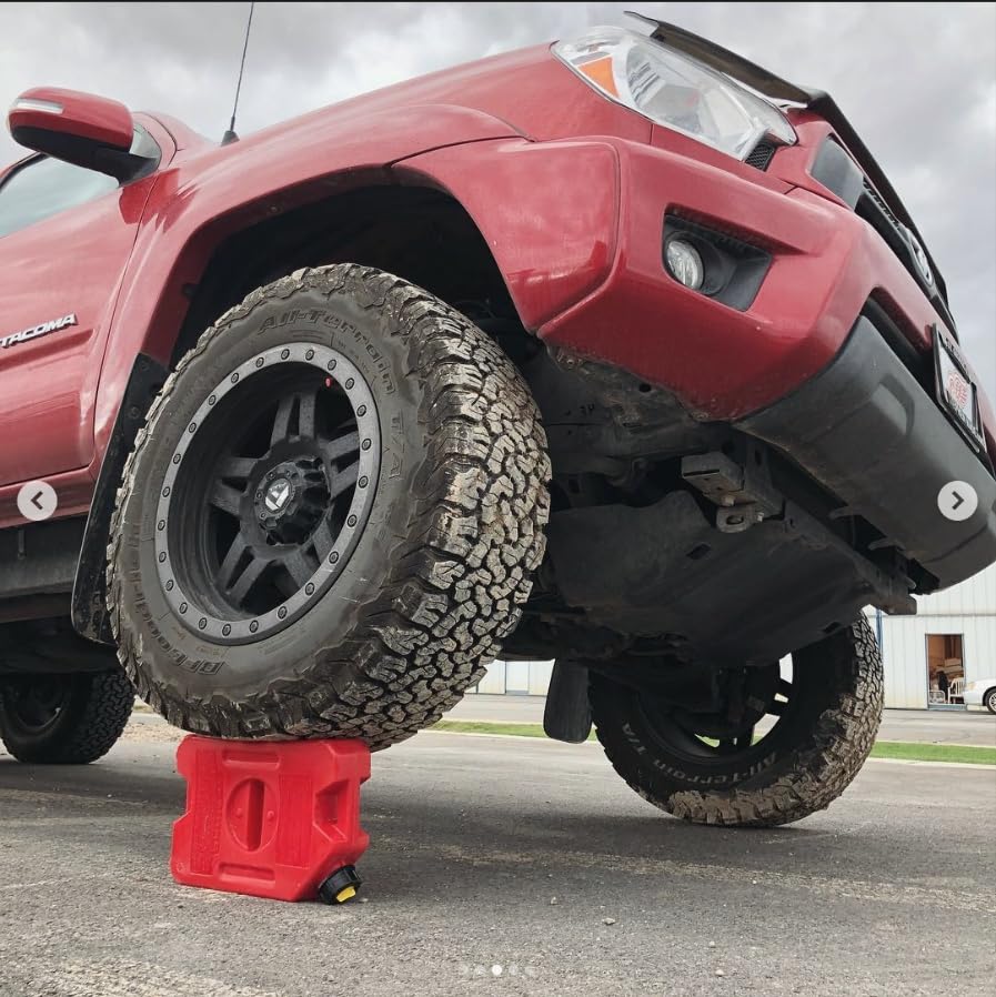 RotopaX pack held in hand for scale shows compact 1-gallon capacity and portability
