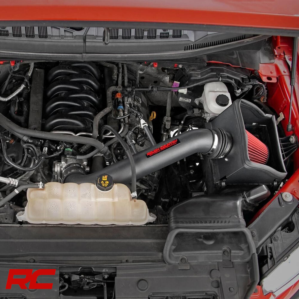 Rough Country intake being installed using factory mounting points