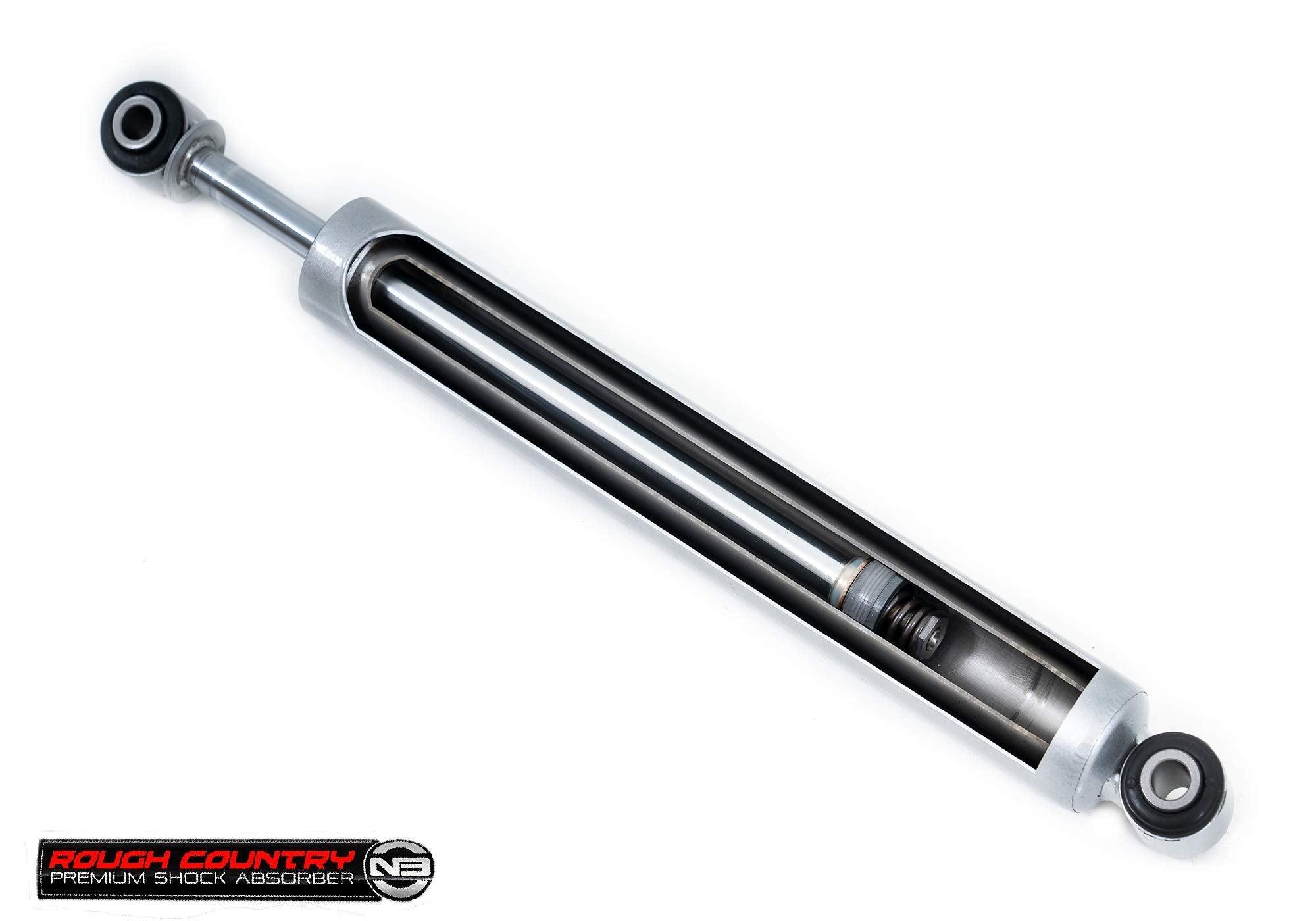 Rough Country shock next to ruler showing 0–3 inch lift compatibility and fitment clarity