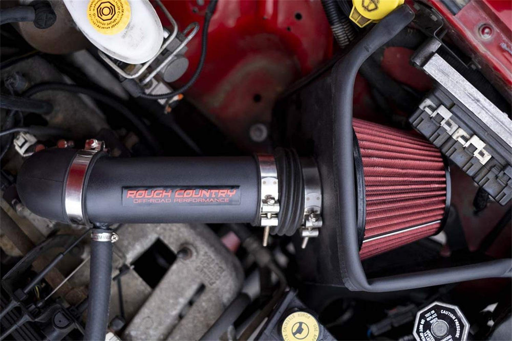 Rough Country intake with pre-filter accessory on dusty trail protecting filter life