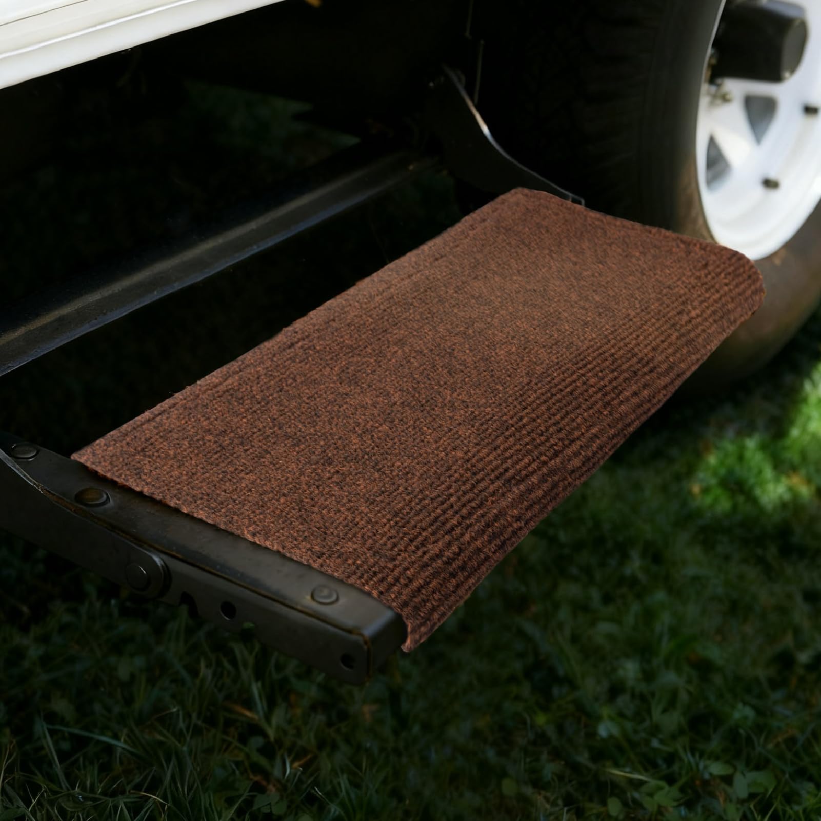 RVMATE lifestyle shot with family entering RV using rugs showing safer footing